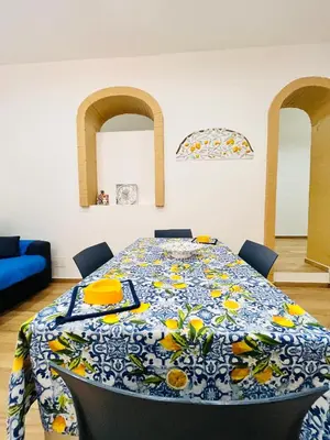 a table with a blue and yellow table cloth on it at Casa Vacanze di Maria in Palermo