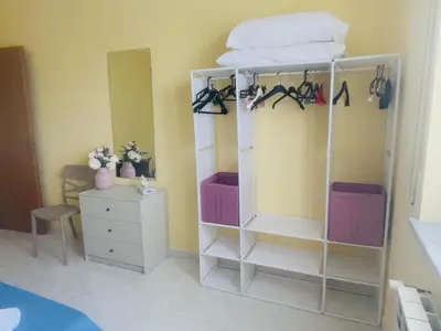 a room with a bunk bed and a dresser at Sicily Holiday Home in Termini Imerese