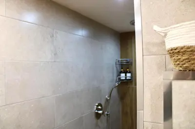 a bathroom with a shower with a shower head at Pillis House, accogliente appartamento in centro città, vicino al Politeama Palermo in Palermo