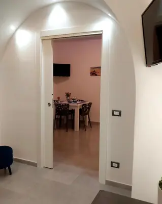 a room with a table and a dining room at Palermo Holiday Room in Palermo