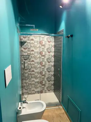 a bathroom with a toilet and a glass shower at bonito apartment2 in Palermo