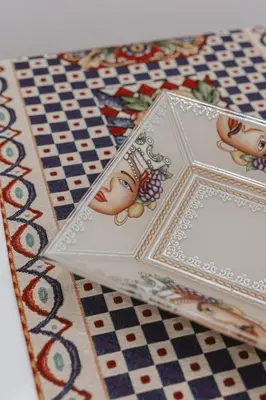 two cards on a table with a chess board at Dimora del Moro in Palermo