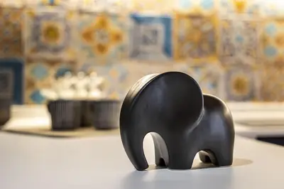 a black elephant figurine sitting on a table at Alloro Apartment 9 in Palermo