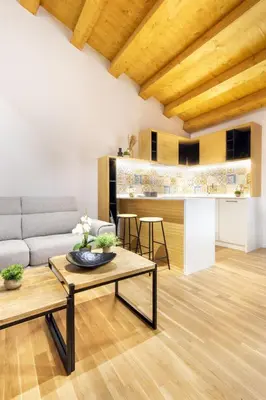 a living room with a couch and a table at Alloro Apartment 9 in Palermo