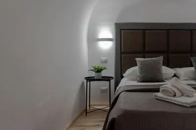 a bedroom with a bed with towels on it at MennulaMia in Palermo