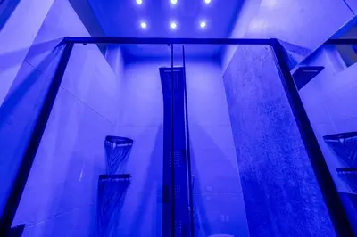 two vases in a room with blue lights at D'ossuna66 Classic in Palermo