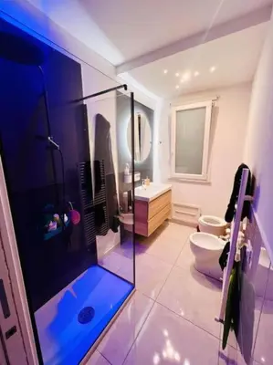 a bathroom with a glass shower and a toilet at Suite Vicino al Mare in Carini
