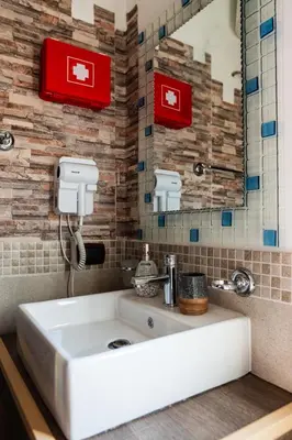 a bathroom with a white sink and a mirror at Locazione Turistica Aurora in Palermo