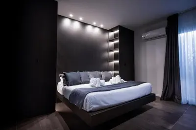 a hallway with a white sink and a staircase at La Mia Terra Boutique Rooms in Palermo