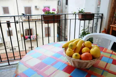 a basket of fruit sitting on top of a table at B&B SoleLuna della Solidarietà in Palermo