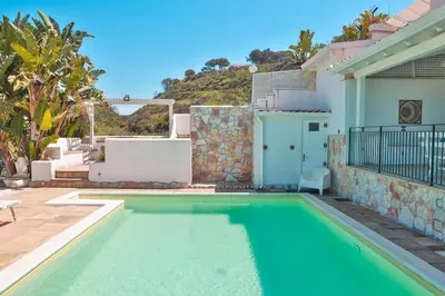 a swimming pool in the backyard of a house at Villa con Piscina 150mt dal Mare 8 Posti OA in Alcamo
