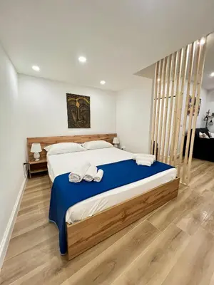 a bedroom with a large bed with two towels on it at Kensia house - centro storico - stazione in Palermo