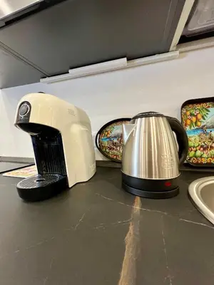 a toaster sitting on top of a counter at Kensia house - centro storico - stazione in Palermo