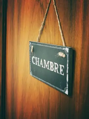 a sign that saysarma hanging on a wall at Marrakech Home in Palermo