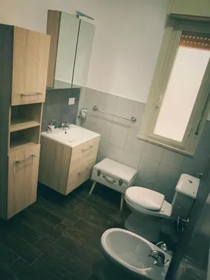 a bathroom with a toilet and a sink at Marrakech Home in Palermo