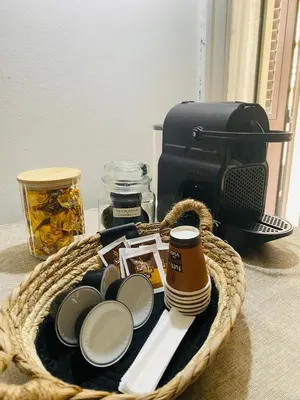 a basket with food and a camera on a table at Politeama House in Palermo