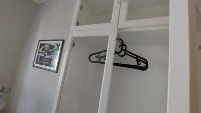 a white door with a black latch on it at Amedeo Suite - Palermo Centro in Palermo