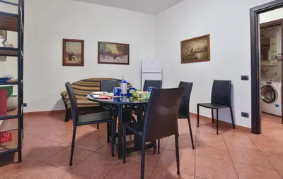 a dining room with a table and chairs at Gorgeous Apartment In Palermo With Wifi in Palermo