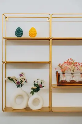 a shelf with flowers and vases on it at Giardino del Foro in Palermo