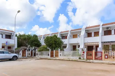 a building with a car parked in front of it at Casa Vacanze Margherita in San Vito lo Capo