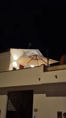 a roof of a house at night with lights on it at Casa Corte Fiorita in San Vito lo Capo