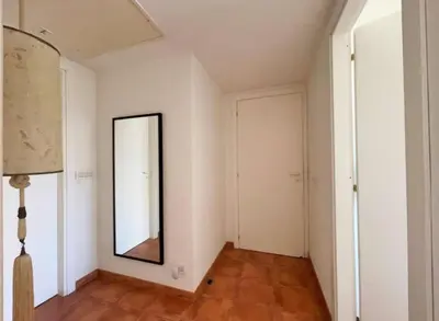 a room with a mirror and a hallway at Casa Corte Fiorita in San Vito lo Capo