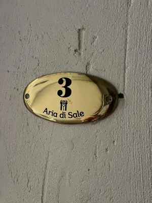 a sign on a ceiling with the number three on it at Aria di Sale centro storico in Palermo