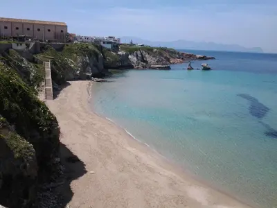 a view of a beach next to the ocean at Casa Praiola in Terrasini