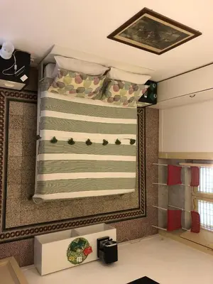 a room with a bed and a window with a curtain at B&B Giulio Cesare 24 in Palermo