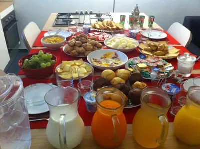 a table full of food and drinks on a table at B&B Giulio Cesare 24 in Palermo