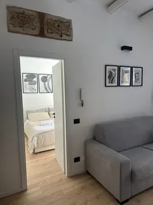 a living room with a couch and a bed at La Dimora Del Centro in Palermo