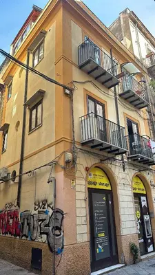 a building with graffiti on the side of it at La Dimora Del Centro in Palermo