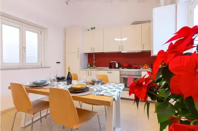 a living room with a couch and a table at Le Sicilien - Moncada de Luna Exclusive Stay in Palermo