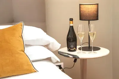 a living room with a couch and a table at Le Sicilien - Moncada de Luna Exclusive Stay in Palermo