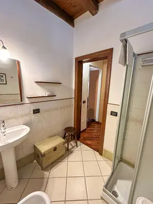 a bathroom with a sink and a shower at Loft in Kalsa - By Rental BeB - in Palermo