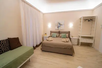 a bedroom with a bed and a book shelf at Scic House in Palermo