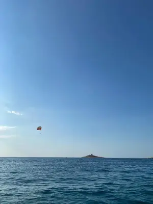 a plane is flying over the ocean at Finestra del mare in Isola delle Femmine