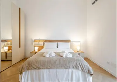 a bedroom with a bed with two towels on it at Residenza Camillo - Palermo Centro in Palermo