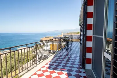 a balcony with a view of the ocean at Trabia Villa Bedda Mia A in Trabia