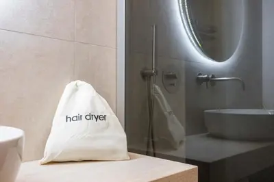 a white bag sitting on a counter in a bathroom at Nora's Suites in Palermo