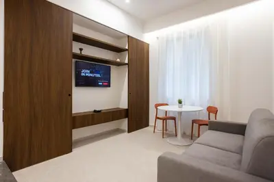 a living room with a couch and a table at Nora's Suites in Palermo
