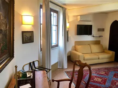 a living room with a couch and a table at Appartamento La Torretta in Mondello