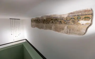 an ancient artifact hanging on the wall of a room at Maison Castro Casetta a Palermo in Palermo