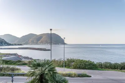 a view of a body of water with a pier at Casa Azzurra vista mare all'Addaura by Wonderful Italy in Palermo