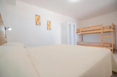 a bedroom with a bed and a bunk bed at A Casa di Amy in Macari
