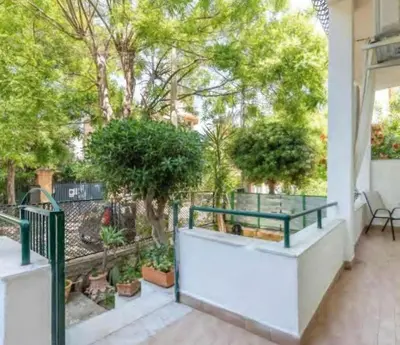 a balcony with a table and some plants at Casa Mondello Sea Life in Palermo
