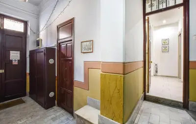 a hallway with doors and stairs in a building at Stunning Apartment In Palermo With Wifi in Palermo