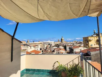 a view of a city from a balcony at In Torre Palazzo Orioles in Palermo