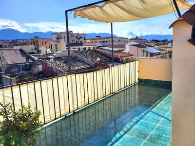 a balcony with a view of a city at In Torre Palazzo Orioles in Palermo