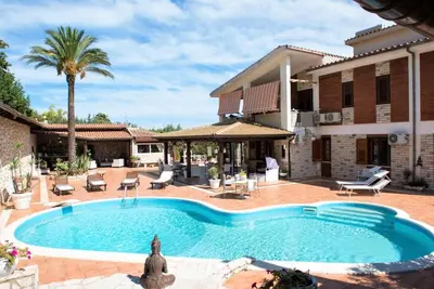 a swimming pool in front of a house at Villa Aversa in Castellammare del Golfo